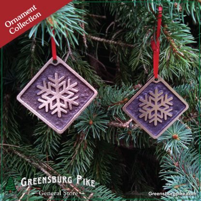 Snowflake ornaments - cast bronze w/red velvet drawstring bag.