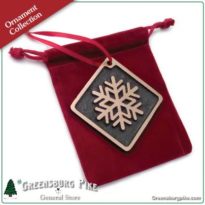 Snowflake ornament - brushed satin finish cast bronze w/red velvet drawstring bag. Made in USA.
